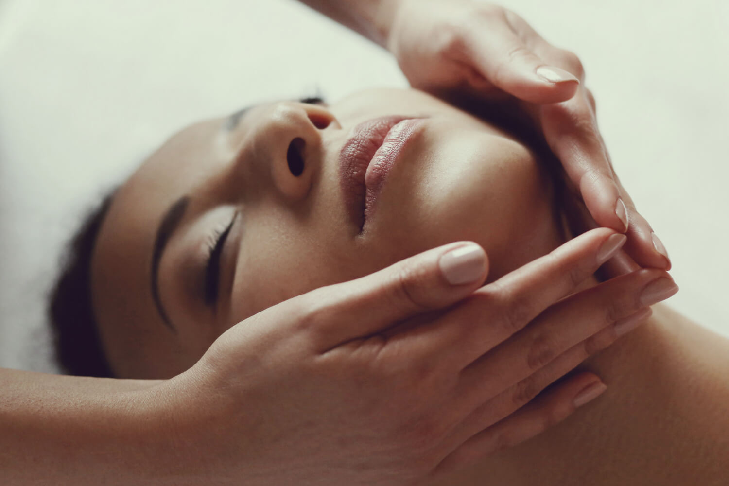african american woman receiving relaxing massage spa