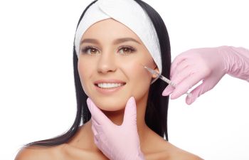 beautiful woman getting facial injectable treatment